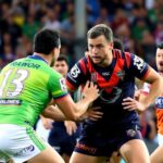 Players from Storm and Panthers clash on the field.