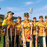Australia women’s cricket team players on field in uniforms