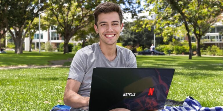 Australian student on campus using Netflix on laptop