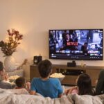 Family watching Netflix together in cosy living room