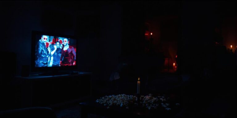 People watching scary movies in a dark living room