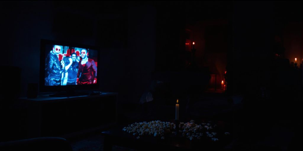 People watching scary movies in a dark living room