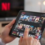 Person about to delete Netflix history on tablet