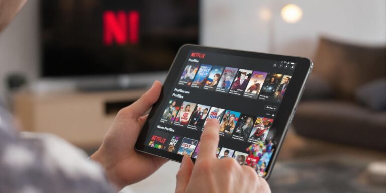 Person about to delete Netflix history on tablet