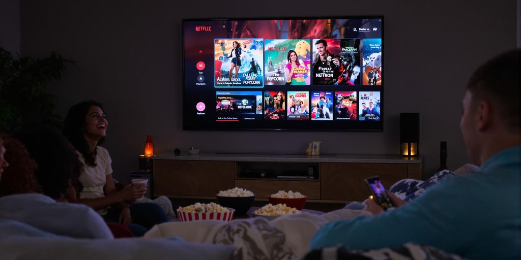 Friends watching Netflix movies together in a cosy lounge